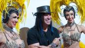 Michael Godard and "Jubilee!" showgirls arrive at the "Veronic Voices" premiere at Bally's on Friday, June 28, 2013.